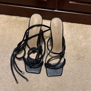 Women’s black strap up heels